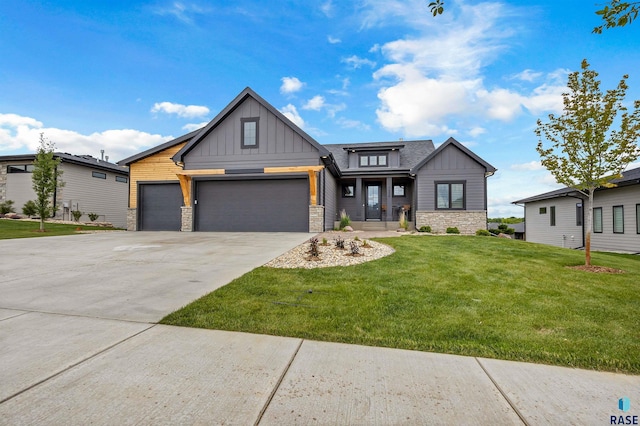 7324 E Twin Pines Ct, Sioux Falls, SD 57110 - view of front of property featuring board and batten siding, stone siding, a front yard, and an attached garage
