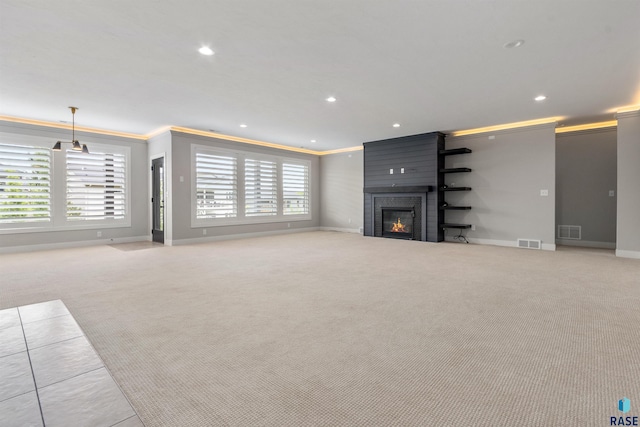 7324 E Twin Pines Ct, Sioux Falls, SD 57110 - unfurnished living room featuring ornamental molding, light colored carpet, baseboards, a large fireplace, and recessed lighting