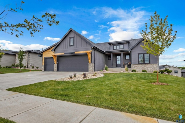 7324 E Twin Pines Ct, Sioux Falls, SD 57110 - view of front of house featuring stone siding, board and batten siding, a front yard, driveway, and a garage
