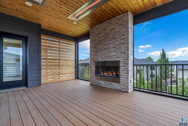 7324 E Twin Pines Ct, Sioux Falls, SD 57110 - wooden terrace with an outdoor brick fireplace