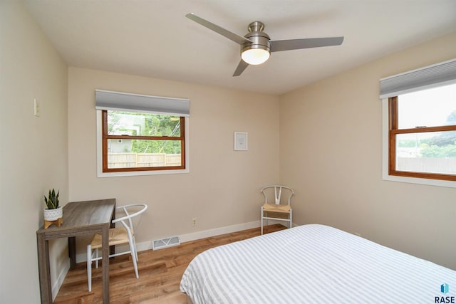 2804 S 1st Ave, Sioux Falls, SD 57105 - bedroom featuring wood finished floors, baseboards, and a ceiling fan