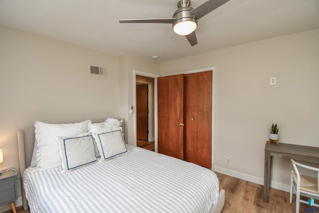 2804 S 1st Ave, Sioux Falls, SD 57105 - bedroom with wood finished floors, a closet, baseboards, and a ceiling fan
