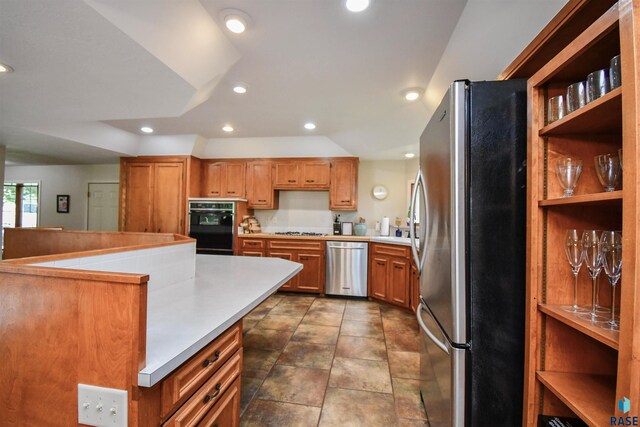 2804 S 1st Ave, Sioux Falls, SD 57105 - kitchen with appliances with stainless steel finishes, recessed lighting, brown cabinets, and open shelves