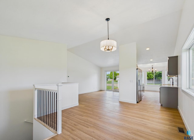 2506 E Augusta St, Brandon, SD 57005 - empty room with light wood-type flooring, baseboards, a chandelier, recessed lighting, and lofted ceiling