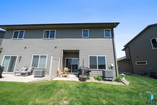 5520 S Seville Pl, Sioux Falls, SD 57108 - rear view of property featuring a patio area, central air condition unit, and a lawn