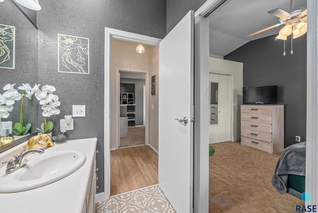1304 N Tahoe Trl, Sioux Falls, SD 57110 - bathroom with vanity, a ceiling fan, lofted ceiling, and a textured wall