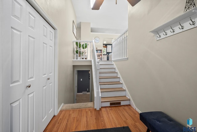 1304 N Tahoe Trl, Sioux Falls, SD 57110 - stairs featuring wood finished floors, ceiling fan, and baseboards