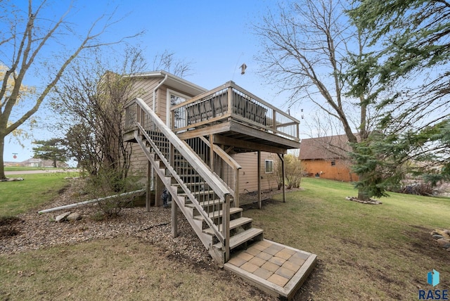 1304 N Tahoe Trl, Sioux Falls, SD 57110 - rear view of property with a wooden deck, a lawn, and stairs
