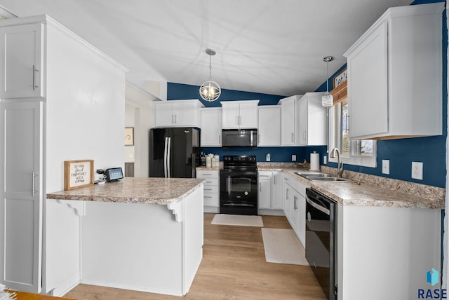 1304 N Tahoe Trl, Sioux Falls, SD 57110 - kitchen featuring black appliances, a sink, a peninsula, vaulted ceiling, and light countertops