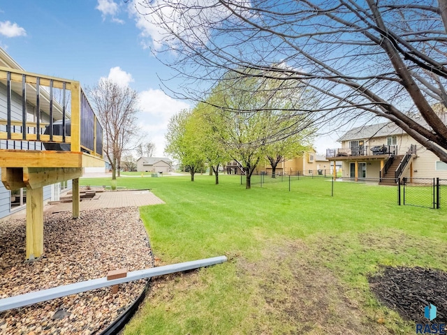 4315 S Cathedral Ave, Sioux Falls, SD 57103 - view of yard featuring a wooden deck and stairs