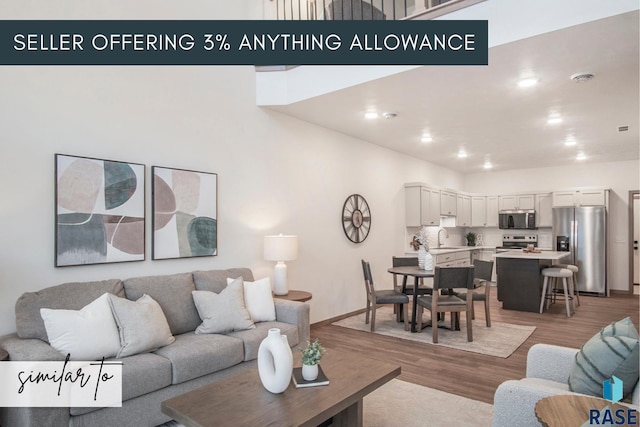 5717 E Avett Pl, Sioux Falls, SD 57108 - living room featuring light wood-style floors and baseboards