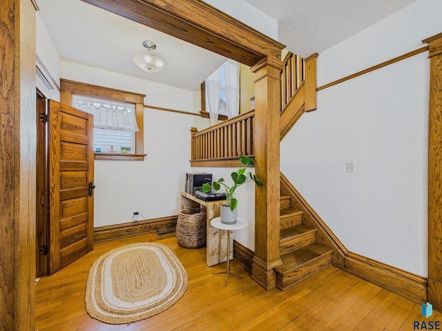 318 W 19th St, Sioux Falls, SD 57105 - foyer entrance with hardwood / wood-style flooring, baseboards, and stairway