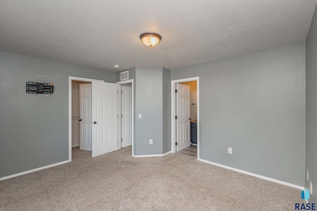 6501 S Santa Rosa Pl, Sioux Falls, SD 57108 - unfurnished bedroom with baseboards, carpet, and ensuite bathroom