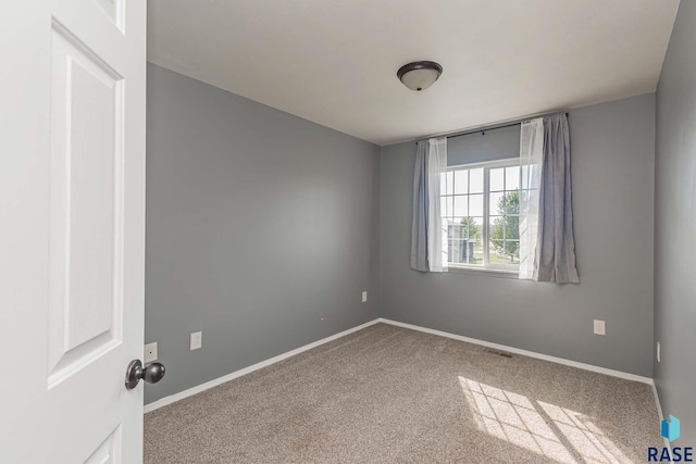 6501 S Santa Rosa Pl, Sioux Falls, SD 57108 - carpeted spare room featuring baseboards