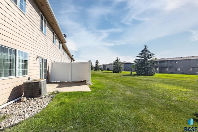 6501 S Santa Rosa Pl, Sioux Falls, SD 57108 - view of green lawn featuring central air condition unit and a patio area
