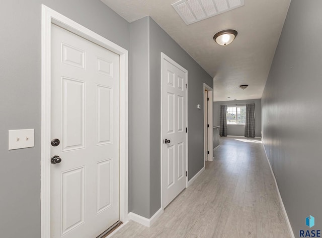 6501 S Santa Rosa Pl, Sioux Falls, SD 57108 - hallway featuring baseboards and light wood-type flooring