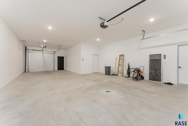 413 W 5th St, Crooks, SD 57020 - garage featuring a garage door opener and recessed lighting