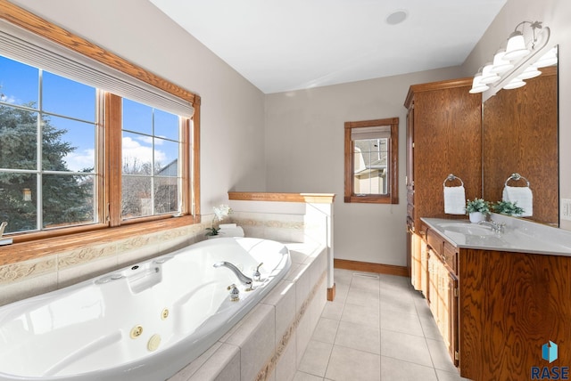 417 E Meadowlark Cir, Brandon, SD 57005 - full bath with vanity, a whirlpool tub, baseboards, and tile patterned flooring