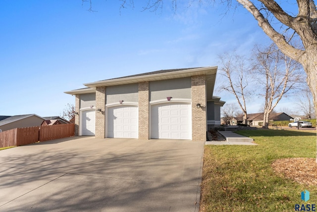 417 E Meadowlark Cir, Brandon, SD 57005 - view of side of property featuring concrete driveway, brick siding, and an attached garage