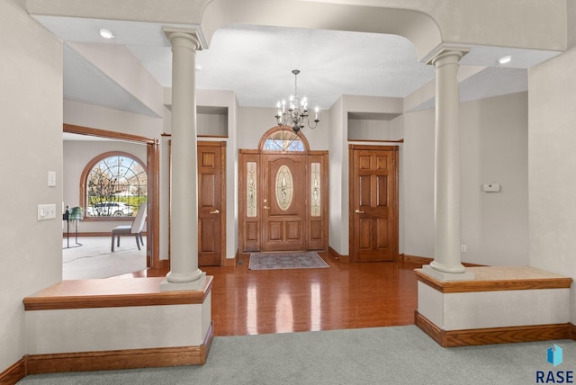 417 E Meadowlark Cir, Brandon, SD 57005 - foyer featuring ornate columns, carpet flooring, baseboards, and a chandelier