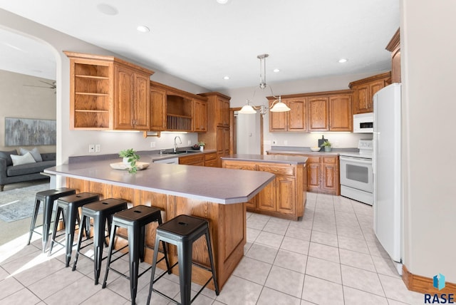 417 E Meadowlark Cir, Brandon, SD 57005 - kitchen featuring white appliances, open shelves, a peninsula, light tile patterned floors, and recessed lighting