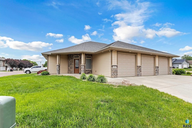 301 S Spring Pl, Brandon, SD 57005 - prairie-style home featuring a front lawn, concrete driveway, an attached garage, and stone siding