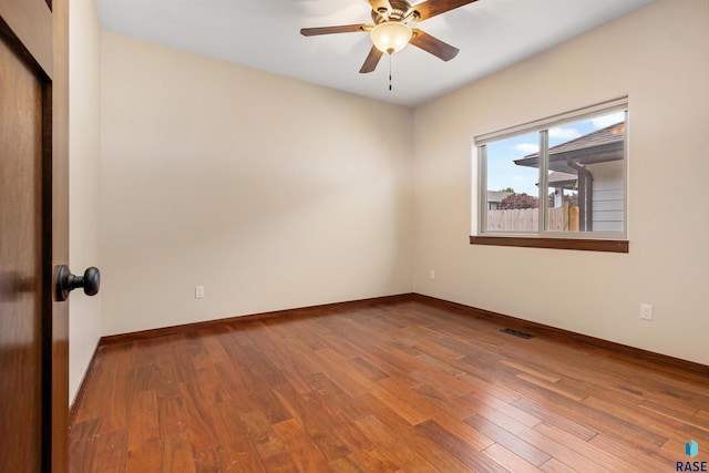 301 S Spring Pl, Brandon, SD 57005 - unfurnished room featuring a ceiling fan, wood finished floors, and baseboards