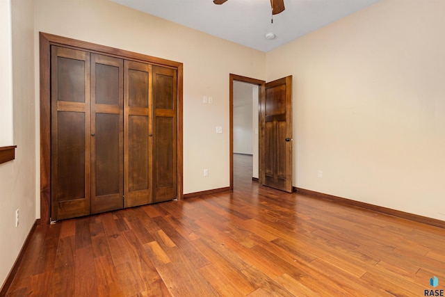 301 S Spring Pl, Brandon, SD 57005 - unfurnished bedroom featuring wood finished floors, baseboards, and a ceiling fan