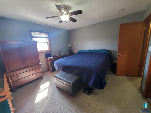 3605 E 18th St, Sioux Falls, SD 57103 - bedroom featuring light colored carpet, ceiling fan, and a textured ceiling