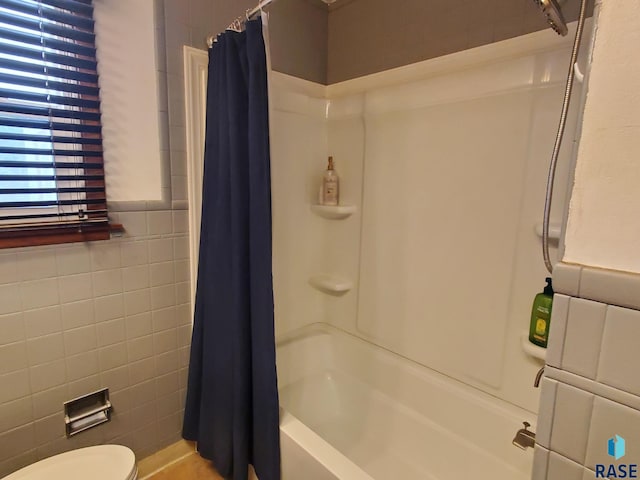 3605 E 18th St, Sioux Falls, SD 57103 - bathroom with tile walls, shower / bathtub combination with curtain, and toilet