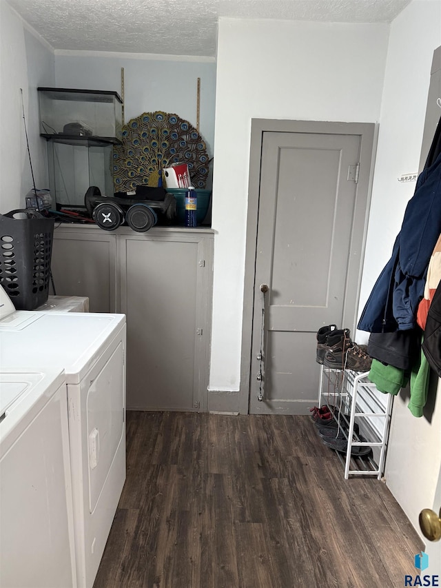 208 E Washington St, Marion, SD 57043 - washroom with dark wood finished floors, washer and clothes dryer, and a textured ceiling