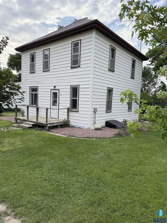 208 E Washington St, Marion, SD 57043 - view of property exterior with a deck and a lawn
