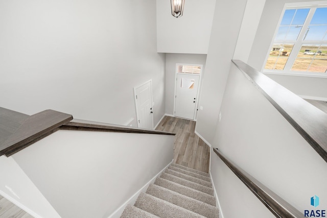 2900 S Copper Creek Ave, Sioux Falls, SD 57110 - staircase with wood finished floors and baseboards