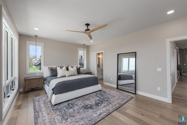 2720 S Oriya Pl, Sioux Falls, SD 57106 - bedroom featuring light wood finished floors, multiple windows, baseboards, recessed lighting, and ceiling fan