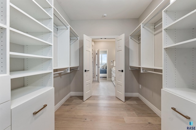 2720 S Oriya Pl, Sioux Falls, SD 57106 - walk in closet featuring light wood-style flooring