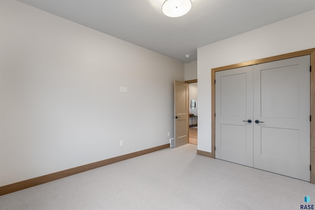 7309 E Shadow Pine Cir, Sioux Falls, SD 57110 - unfurnished bedroom with light carpet, baseboards, and a closet