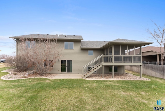 7005 E Archstone St, Sioux Falls, SD 57110 - rear view of property featuring a sunroom, stairs, a lawn, and a patio area
