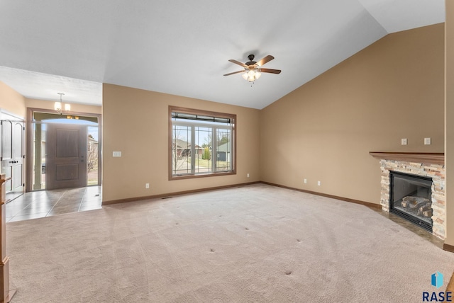 7005 E Archstone St, Sioux Falls, SD 57110 - unfurnished living room with lofted ceiling, ceiling fan, carpet floors, baseboards, and a fireplace