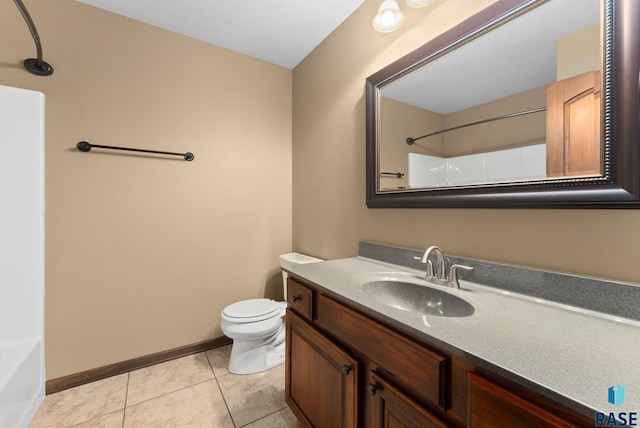 7005 E Archstone St, Sioux Falls, SD 57110 - bathroom with toilet, vanity, tile patterned flooring, and baseboards