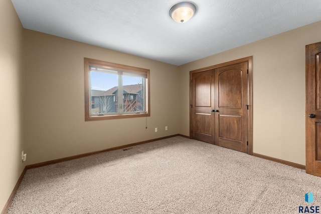 7005 E Archstone St, Sioux Falls, SD 57110 - unfurnished bedroom with carpet flooring and baseboards