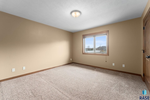 7005 E Archstone St, Sioux Falls, SD 57110 - spare room featuring light colored carpet and baseboards