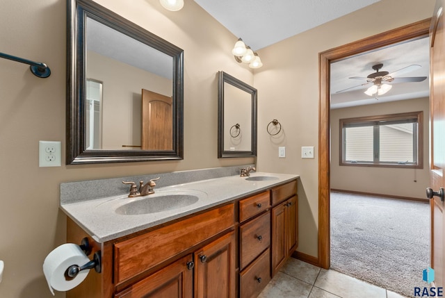 7005 E Archstone St, Sioux Falls, SD 57110 - bathroom with double vanity, tile patterned floors, ceiling fan, and baseboards
