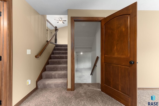 7005 E Archstone St, Sioux Falls, SD 57110 - stairway featuring carpet flooring, a ceiling fan, and baseboards