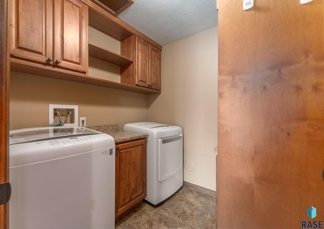 7005 E Archstone St, Sioux Falls, SD 57110 - laundry room with cabinet space, washer and dryer, and baseboards