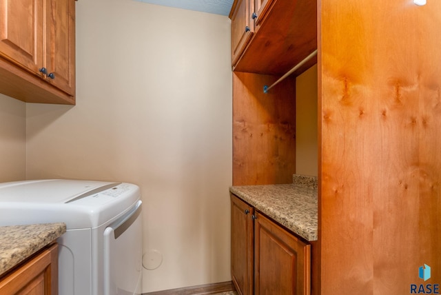 7005 E Archstone St, Sioux Falls, SD 57110 - laundry area featuring cabinet space, washer and clothes dryer, and baseboards
