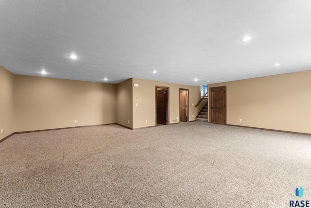 7005 E Archstone St, Sioux Falls, SD 57110 - finished below grade area with recessed lighting, baseboards, stairs, and light carpet