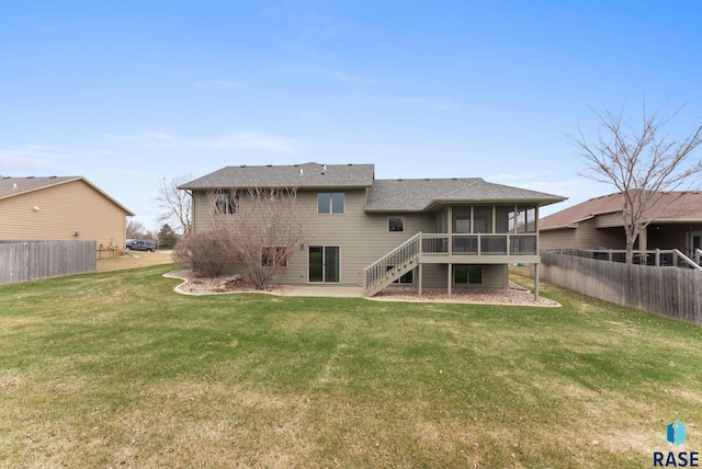 7005 E Archstone St, Sioux Falls, SD 57110 - rear view of house with a sunroom, stairs, and a shingled roof