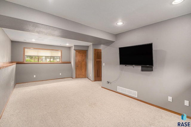 5547 S Wexford Ct, Sioux Falls, SD 57106 - unfurnished living room featuring baseboards, recessed lighting, and light carpet