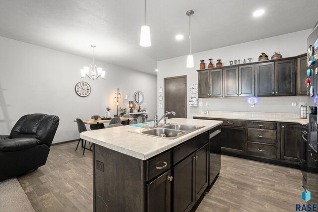 2554 E Meadowside Pl, Sioux Falls, SD 57108 - kitchen featuring a sink, light wood-type flooring, a chandelier, light countertops, and recessed lighting