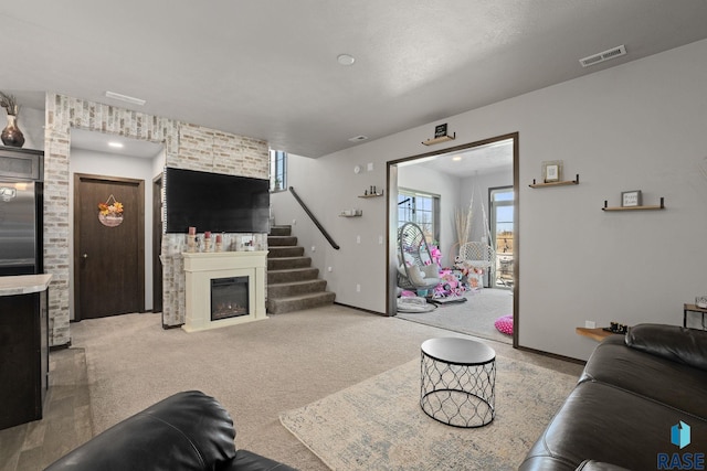 2554 E Meadowside Pl, Sioux Falls, SD 57108 - carpeted living room with a glass covered fireplace, baseboards, and stairway